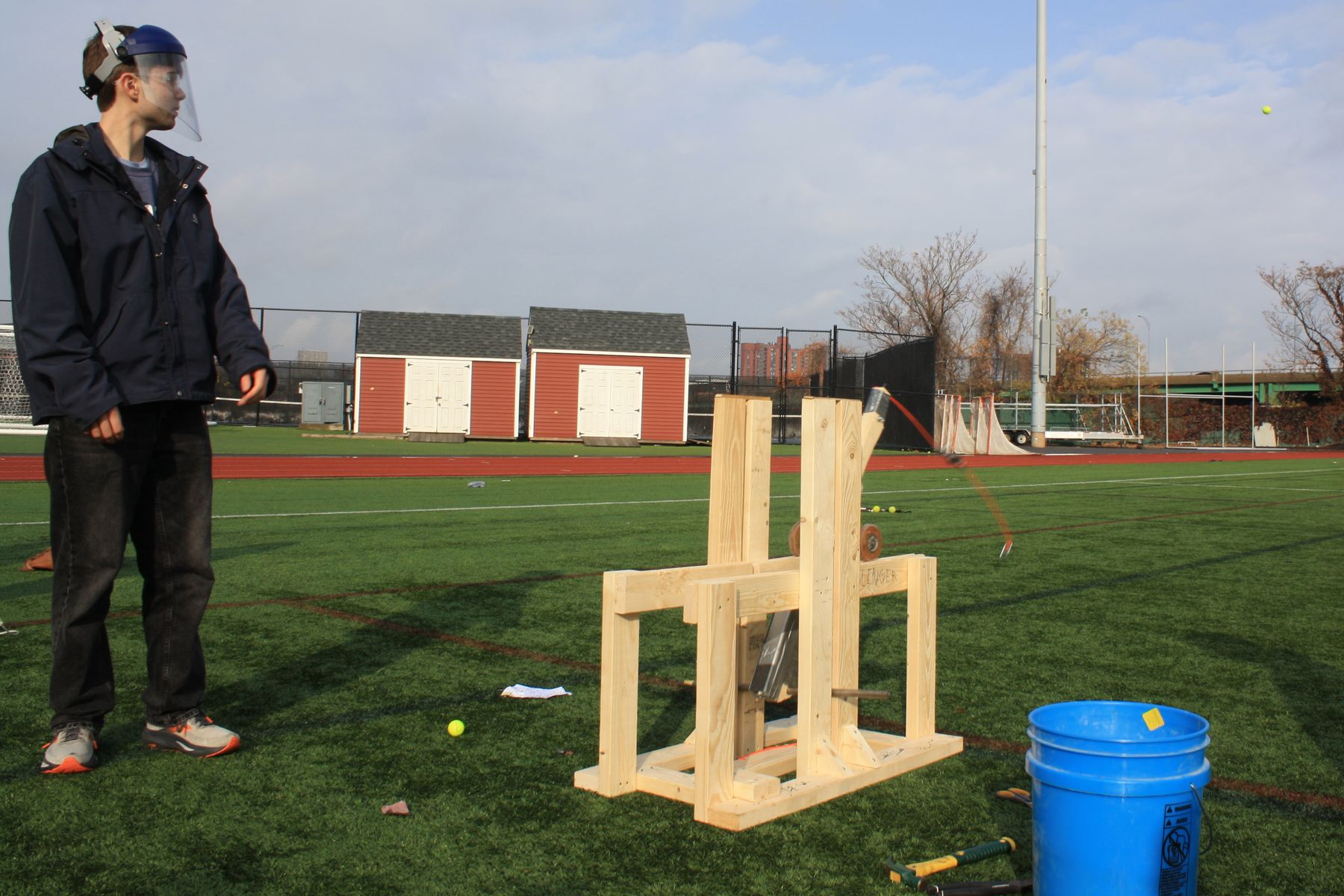 a student watching the swing of his catapult after launch