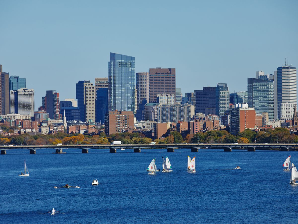 Wide shot of Harvard bridge on Charles river with sailboats on the water