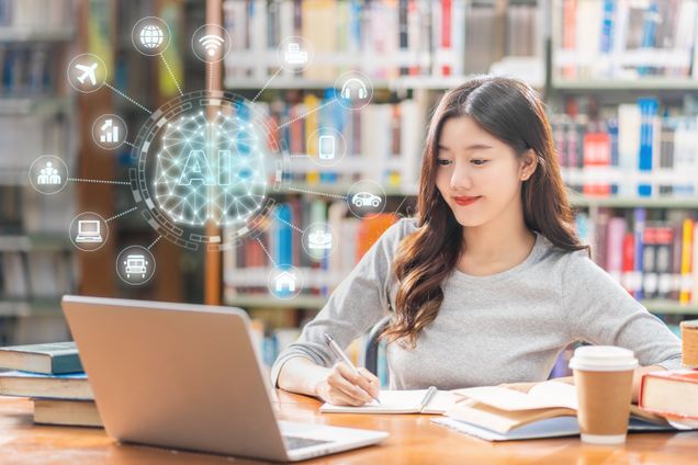In a library, a young woman is studying with a laptop open in front of her. An AI graphic appears above the computer.