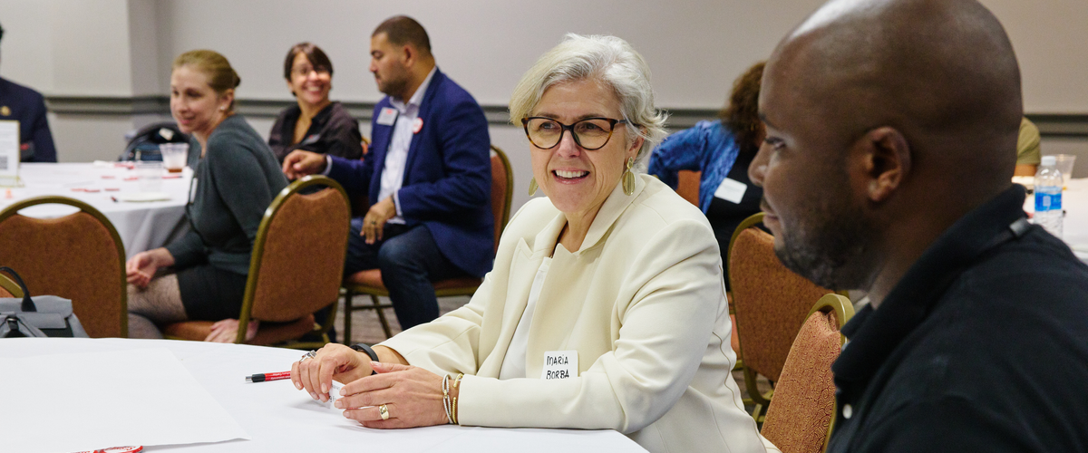 Faculty & staff mingling at a reception
