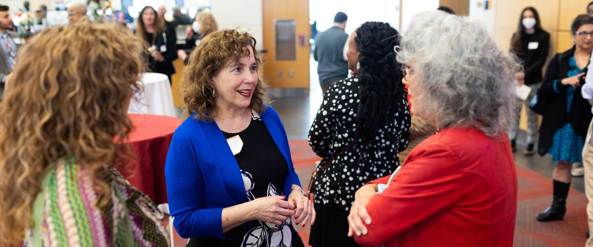 Faculty mingling at a celebration of research