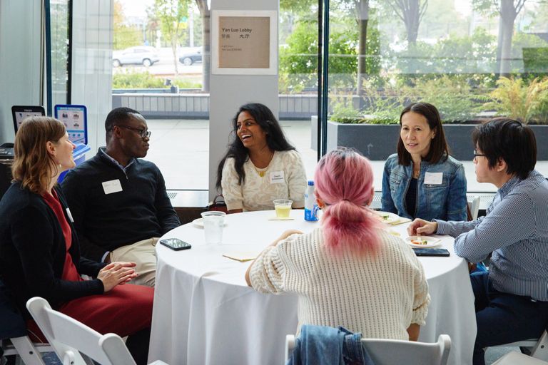 Faculty mingling at a reception