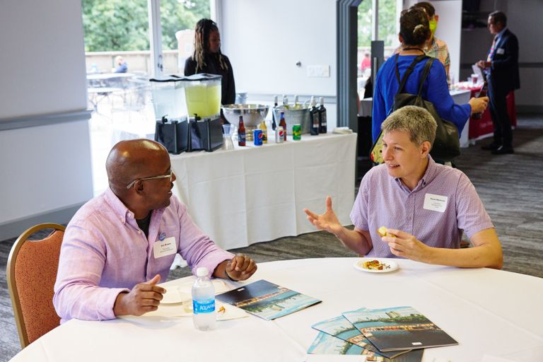 Faculty mingling at a reception