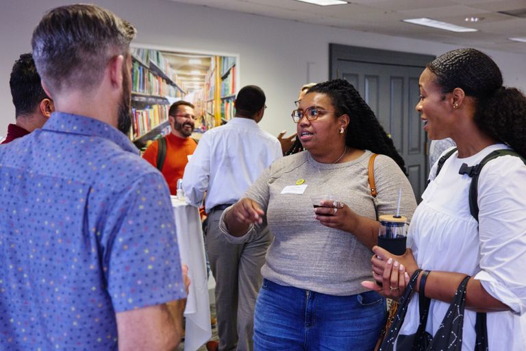 Faculty mingling at a reception