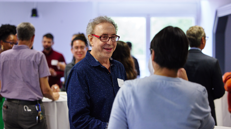 Faculty mingling at a reception