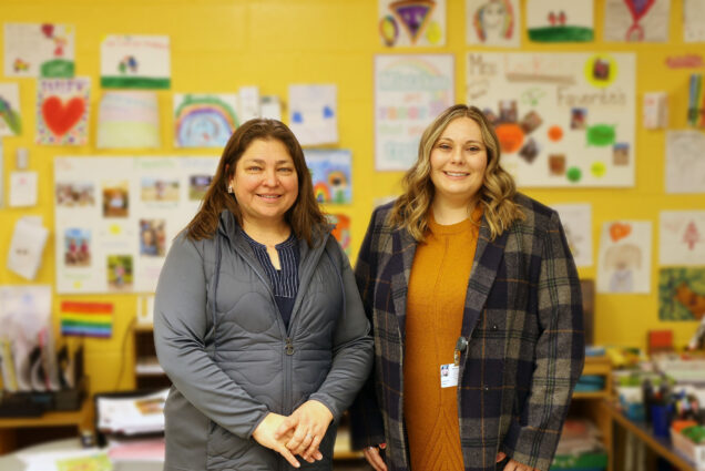 Patricia Fabian (left), a BU School of Public Health environmental health researcher, with Katherine Walsh, who leads Boston Public Schools’ sustainability efforts, in a classroom at the Dr. Catherine Ellison/Rosa Parks Early Education School in Mattapan, Mass., where a sensor continuously monitors indoor air quality. 