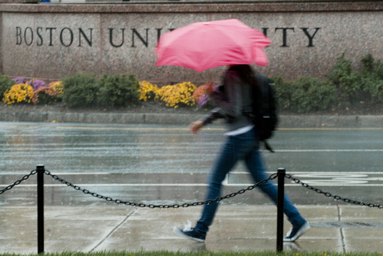 Robert Kaufman, professor of of earth and environment in Boston University’s College of Arts and Sciences, with rooftop solar panels at Boston University