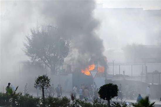 American Cooperative School of Tunis on fire burning during attack by Muslim extremist group