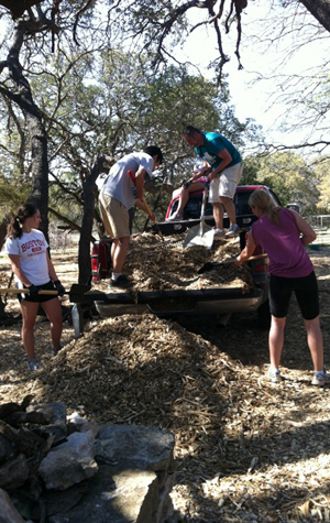 ASB Killeen, TX: wood chips, site maintenance Boston University BU, alternative spring breaks ASB, community service, voluneer, Killeen Texas