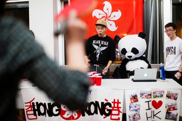 Brian Lee (CAS 16) reacts while manning a ping pong game table as Kevin Chan (SMG 18) looks on during the Asian New Year celebration at GSU 