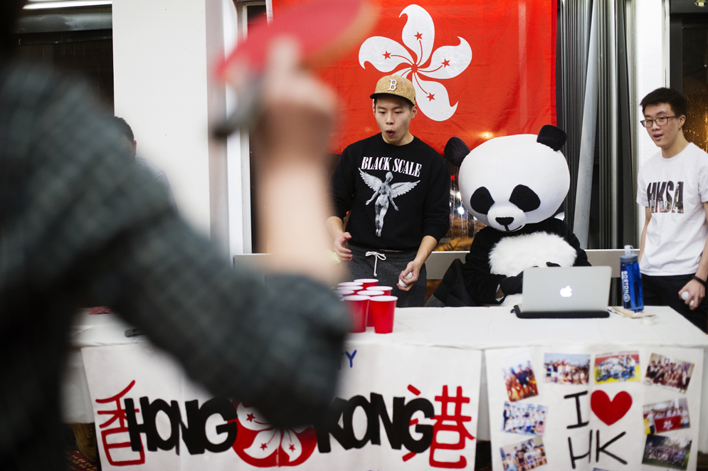 Brian Lee (CAS 16) reacts while manning a ping pong game table as Kevin Chan (SMG 18) looks on during the Asian New Year celebration at GSU 