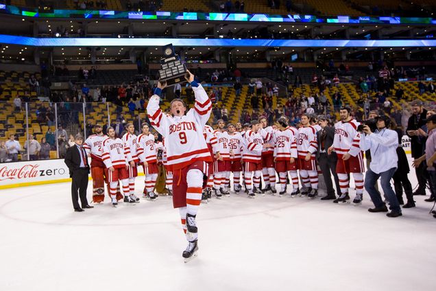 Jack Eichel hoists the Lamoriello trophy after the BU Terriers men's ice hockey team won the Hockey East title