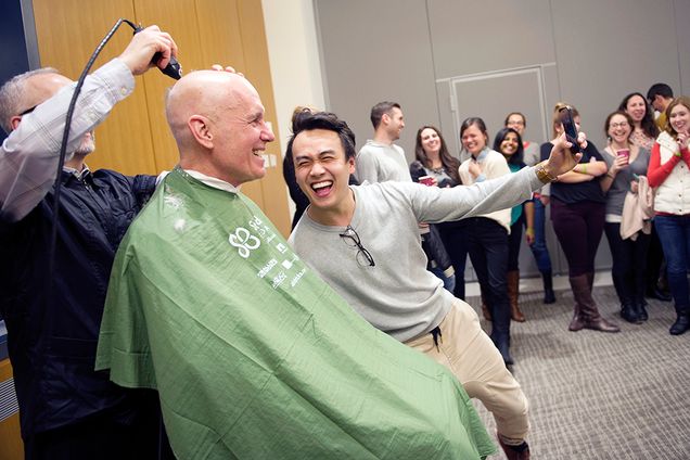 Albert Heng (LAW'15) grabs a selfie with Law Professor, Stephen Marks as he gets his head shaved on Thursday, March 26, 2015. Law School Student Anshul M. 