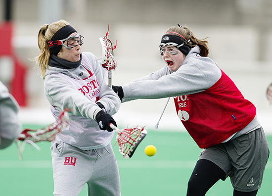 Jenny Thompson (SAR 16) takes a shot on goal as Brynne Yarranton (SAR 17) defends during practice on Friday, March 6, 2015 Photo By Jackie Ricciardi for Boston University Photography