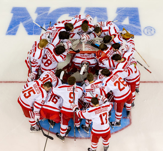 The Terriers huddle around goalie Matt O’Connor (Questrom’16), as they prepare for tonight’s Frozen Four semifinal against North Dakota.