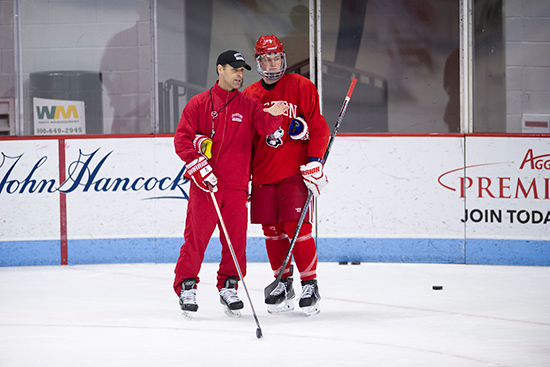 Men’s hockey head coach David Quinn (CAS’89) and Hobey Baker Award finalist Jack Eichel (CGS’16) confer at practice during this season’s run to the NCAA semifinals.