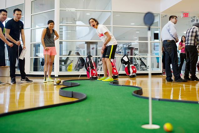 Asma Inam (SAR 15) reacts to missing a hole in one as Jessica Liao (CAS 16), Noah Liu (CAS 17) and Alan Tang (QUESTROM 15) looks on during a mini golf game at Fit Rec on Wednesday, April 15, 2015. Photo by Jackie Ricciardi 
