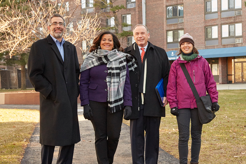 Robert Kaufmann (far left) and Marta Marello (far right) with MPDC Executive Director Jeanne Pinado (second from left) and a representative of Wells Fargo.
