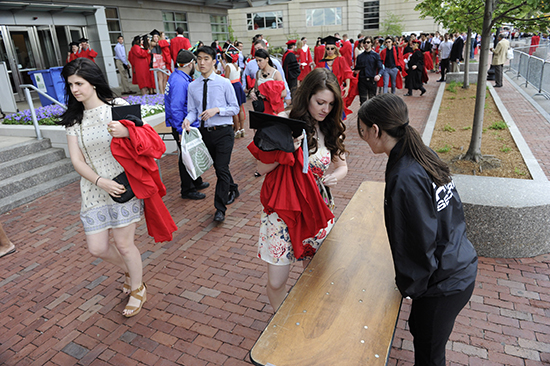 As with last year, graduates and faculty must carry their robes to Nickerson Field and dress in designated areas once there. Photo by Jackie Ricciardi
