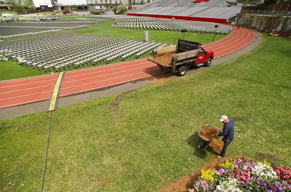 Mike McAleer of BU's facilities crew beautifies Nickerson Field for Sunday's commencement  on May 13, 2015. 