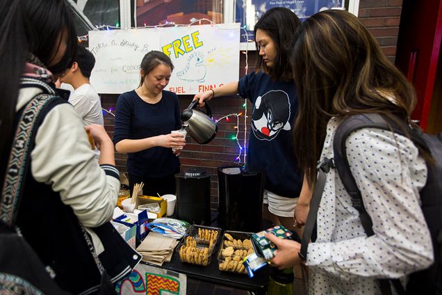Elisabeth McNeil (SAR'16) (left) and Hannah Kwak (SHA'18) Asian American Christian Fellowship encourages students to take a study break with free hot drinks and cookies in front of Mugar from 9 pm - 1 am during finals week. May 4, 2015. Photo by Esther Ro (COM'15)