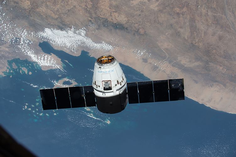 SpaceX Dragon private cargo spacecraft in space during its first mission to the International Space Station