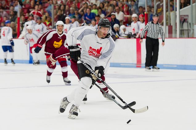 Joe Pandolfo scores the first goal of the Comm Ave Charity Classic hockey game at Boston University