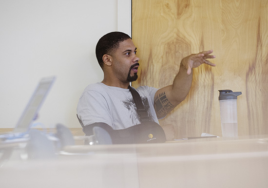 Boston police officer Jean-Paul Limontas (MET’16) makes a point about community policing policy during a recent class of the MET summer course Race, Crime, and Justice.