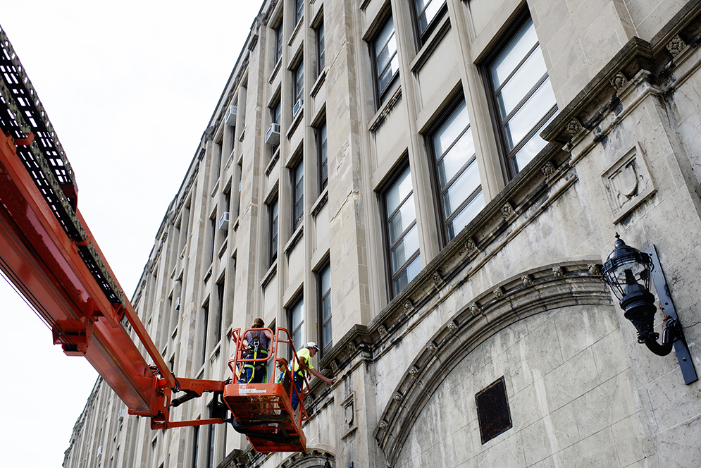 A construction team looks at what needs to be repaired on the College of Fine Arts building on Thursday, May 25, 2015 Photo By Jackie Ricciardi 