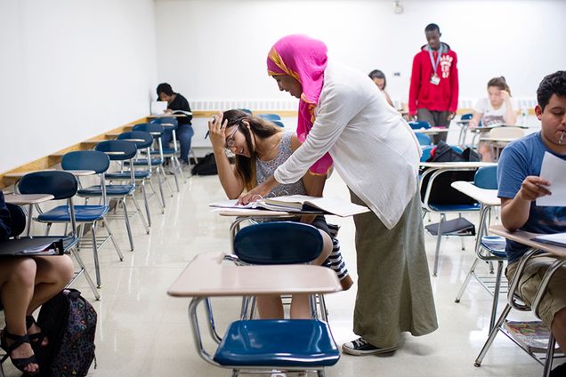 Maryan Sharif (SAR 17) helps high school student, Jasmine Salazar with pre-calculus during the Upward Bound Math Science study hall