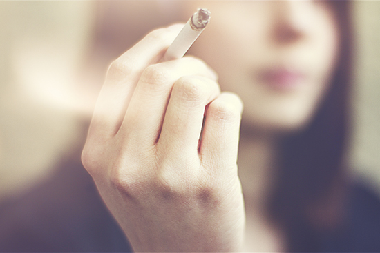 Girl with cigarette in hand