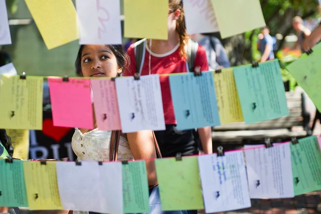 Paroma Mallick (ENG'18) regards the MassCreative booth at the Arts Fair at the GSU September 18, 2015. Photo by Cydney Scott