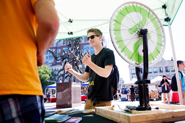 Jared Brill (COM'18) celebrates after winning a T-shirt from the Hubway booth at the Sustainability Festival on Thursday, September 17, 2015. Photo By Jackie Ricciardi