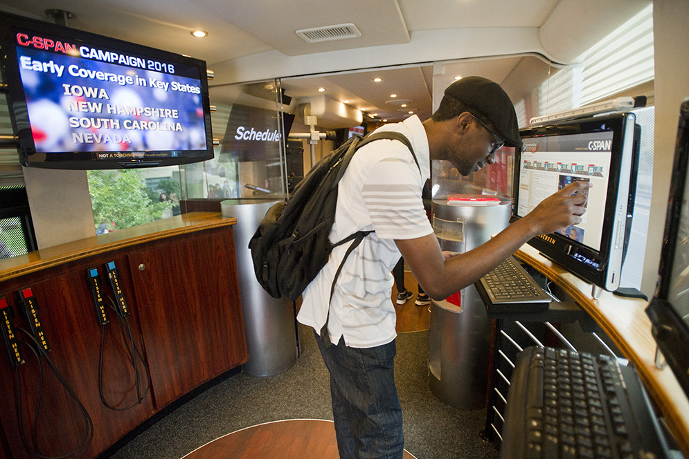 Nehemiah Dureus (ENG'19) explores the C-SPAN Campaign Tour Bus parked outside Marsh Plaza September 22, 2015. Photo by Cydney Scott