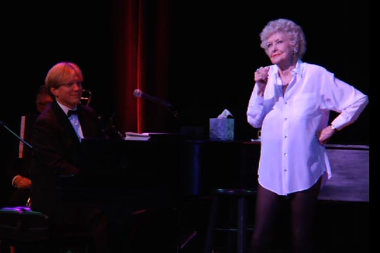 Stritch in her signature white blouse and black leggings with her longtime musical director Rob Bowman, in a scene in Elaine Stritch: Shoot Me. Photo courtesy of Isotope Films