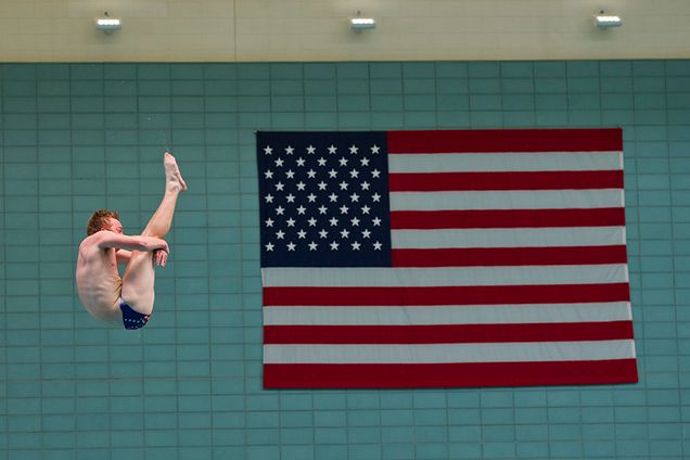David Thiede (ENG'19) works on a forward two-and-a-half somersault pike during BU's Swimming and Diving team practice at FitRec October 7, 2015. The team practices six times a week at the pool and lifts an additional three times a week. 