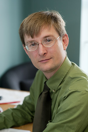 Paul Withers, an assistant professor of astronomy, is a participating scientist on NASA’s MAVEN mission, which has been circling Mars since 2014 to study its upper atmosphere. He calls The Martian a great movie. “All scientists are that handsome--and beautiful,” he says. Photo by Vernon Doucette