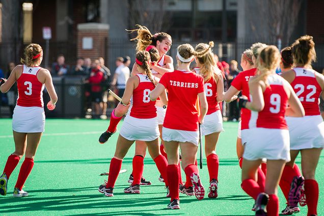 Sofi Laurito (COM'16), facing, runs straight to her teammates after scoring the game-winning point in double overtime, to send BU to the Patriot League championship game following a 3-2 win over Bucknell at New Balance Field November 6, 2015. Laureate performed the first three scoring hat trick since 2009, and the double overtime game was the first since 1994. Photo by Cydney Scott