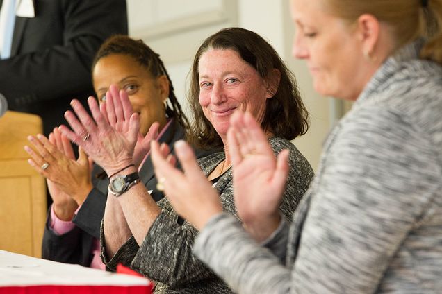 Robyne Johnson (track & field and cross country), from left, Nancy Feldman (women’s soccer), Brian Durocher (women’s ice hockey) (behind Steding), and Katy Steding (women’s basketball) headlined a panel discussing an effective educator and mentor, particularly for female athletes during the Boston University Women’s Guild Lunch & Learn event on Tuesday, Nov. 10, at the BU Photonics Building. Photo by Cydney Scott