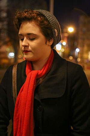 Mackenzie McGraw (SED'19) addresses students gathered at Marsh Chapel plaza Saturday evening for a candlelight vigil she organized as a tribute to the Paris victims and call for peace and understanding