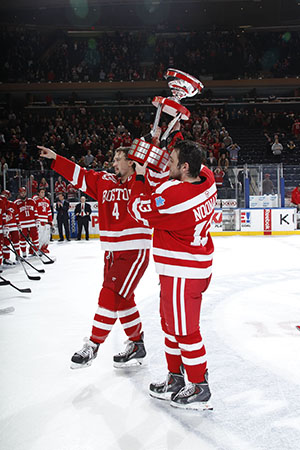 Cocaptains Patrick MacGregor (CGS’12, COM’14) and Garrett Noonan (CGS’12, MET’15) hoist the Kelley-Harkness Cup following BU’s 3-2 win over Cornell at the 2013 Red Hot Hockey game at Madison Square Garden.