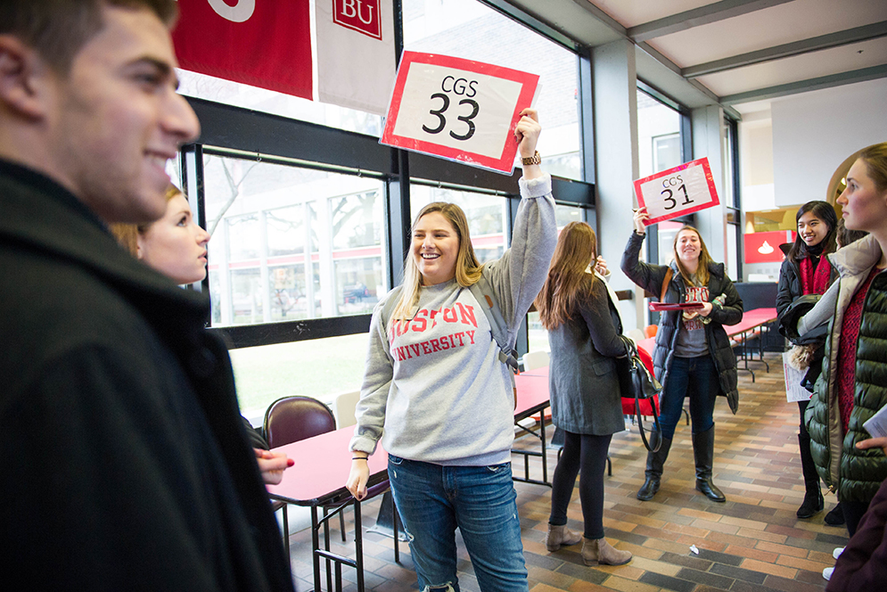 Alison Hart (CAS'17) greets students at the GSU during the transfer orientation program on Friday, January 15, 2016. Photo by Jackie Ricciardi 