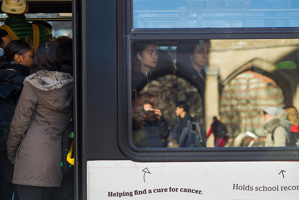 Students cram on to the BUs to head west on Commonwealth Ave from he Marsh Plaza stop January 28, 2016. Photo by Cydney Scott