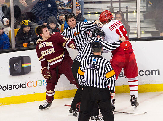 A referee breaks up a fight between Jordan Greenway and Casey Fitzgerald during the 2016 Beanpot Tournament Championship Game