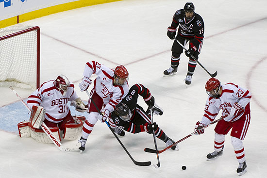 2/1/16 -- Boston, Massachusetts BU Terriers from right Jakob Forsbacka Karlsson (CAS'19), Doyle Somerby (COM'17) and goalie Sean Maguire (CAS'16) swarm around an off balance Adam Gaudette of Northeastern during the Beanpot Semifinal at the TD Garden on February 1, 2016. Photo by Andy Costello for Boston University Photography