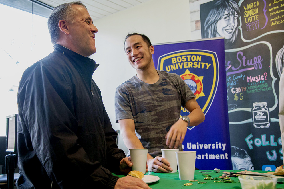 Eddy Cao and BUPD officer Scott Paré during the Cup O' Coffee with the Cops event at Pavement Coffeehouse