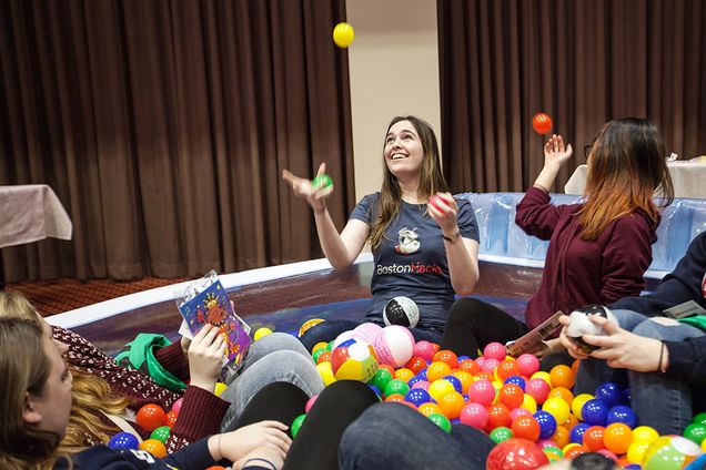 Amalia Safer (CAS '17) (center) along with Viviana Yee (CAS '17) (right) relieve stress in a ball pit at Boston University's Fresh Check Day Monday in Metcalf Hall. The day featured booths and activities focused on aspects of wellness and mental health. Photo by Alexandra Wimley (COM '17)