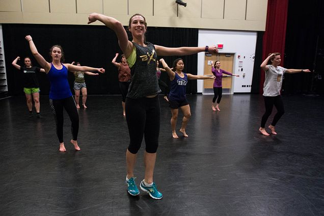 Ellie Steever, art director at BU MarCom and a dance instructor, teaches a session of BollyX, a Bollywood-based cardio dance fitness class to a group of BU dance enthusiasts at the Dance Theatre at the BU FitRec Center. Photo by Pankaj Khadka (COM'16)