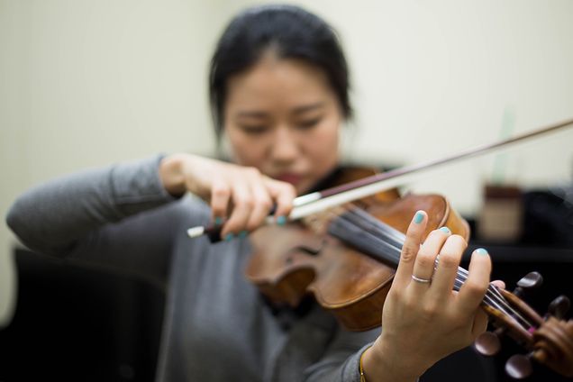 Chae Young Yeom (CFA'16), plays Antonin Dvorak's String Quintet in G Major while preparing for her chamber rehearsals inside one of the practice rooms at CFA. Photo by Pankaj Khadka