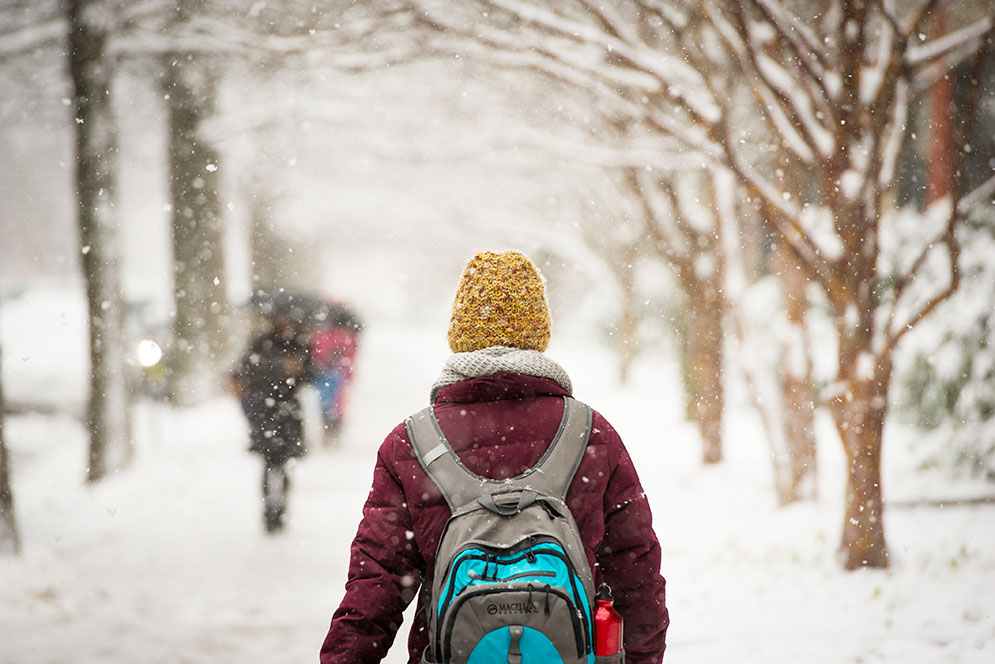 First day of spring? It sure doesn't look like it. Students were still out in force along Bay State Road as the snow falls. Photo by Cydney Scott